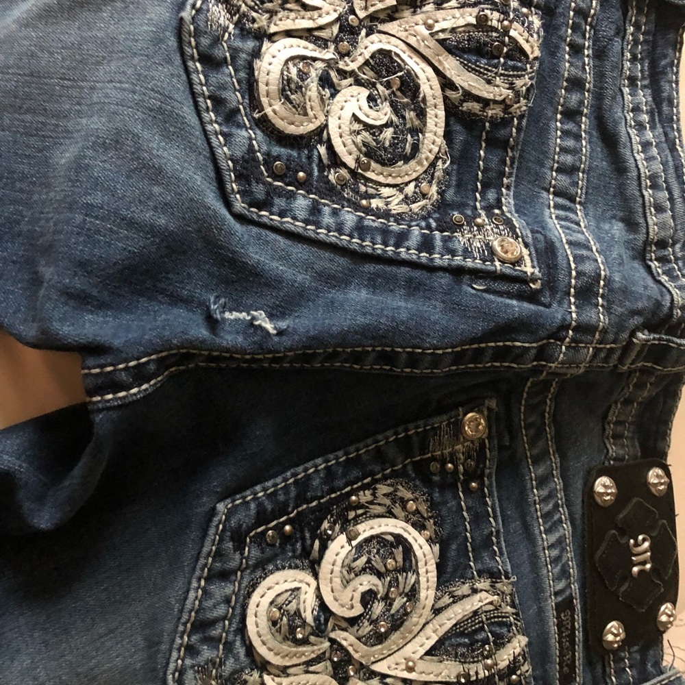 Miss Me jeans with a small tear in the rear